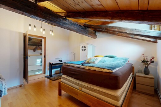 room with wooden ceiling and light wood finished floors