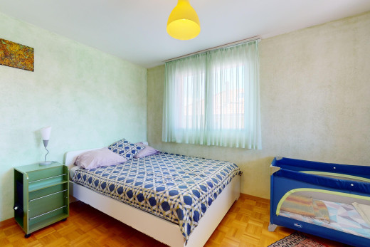 room / bedroom featuring parquet flooring