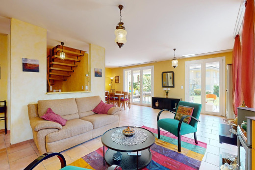 tiled living room featuring ornamental molding