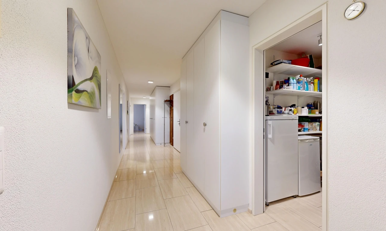 hallway with washer / dryer and recessed lighting