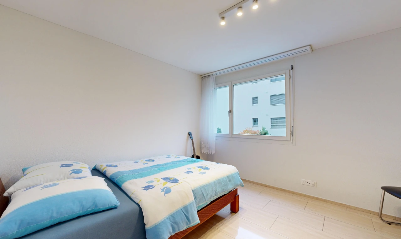 room / bedroom with track lighting