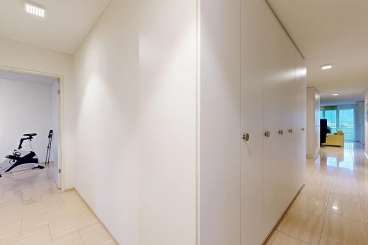 corridor with recessed lighting