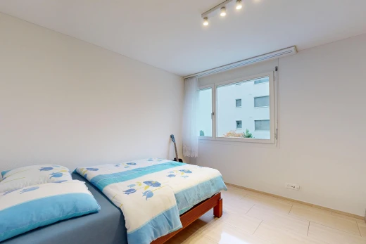 room / bedroom with track lighting