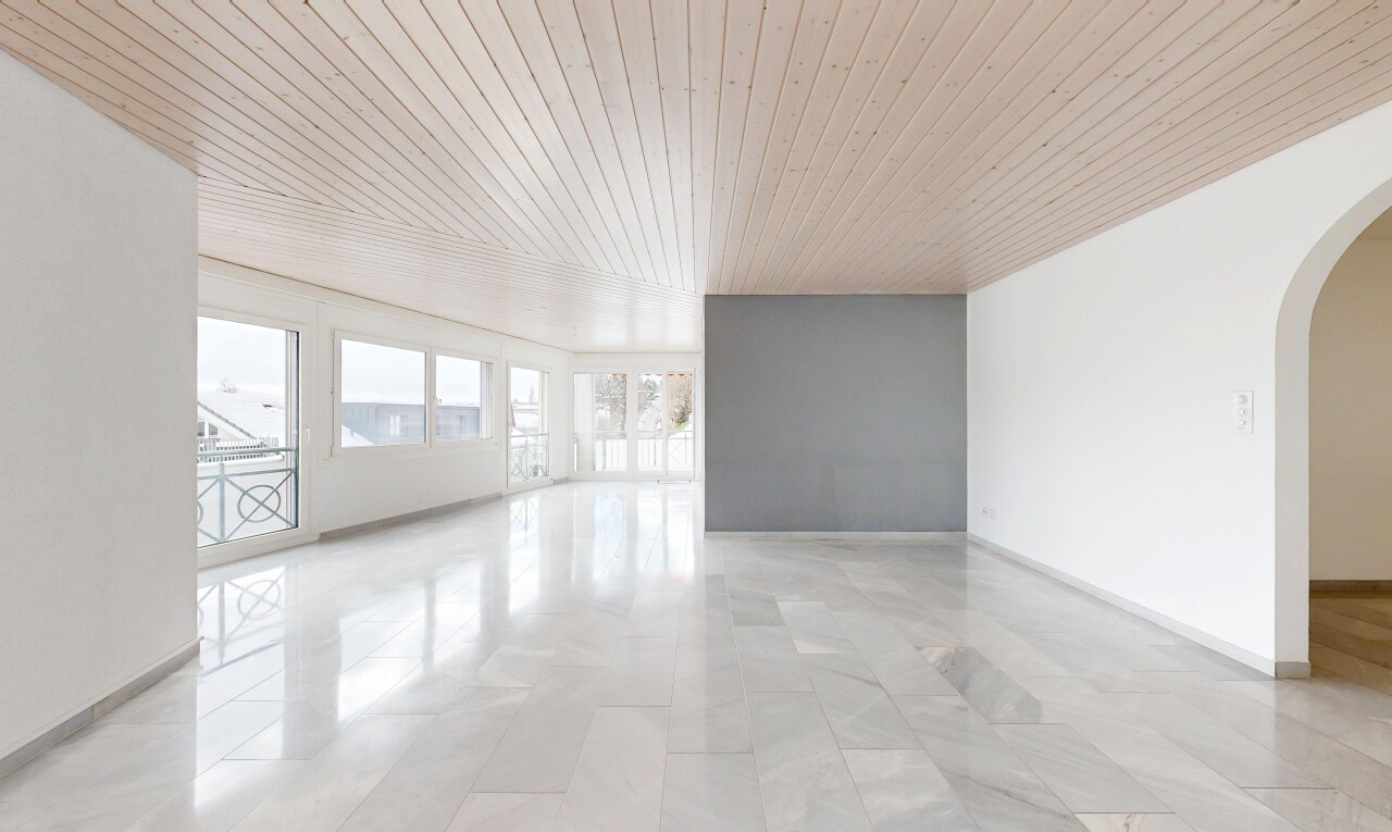 unfurnished room featuring arched walkways and wooden ceiling