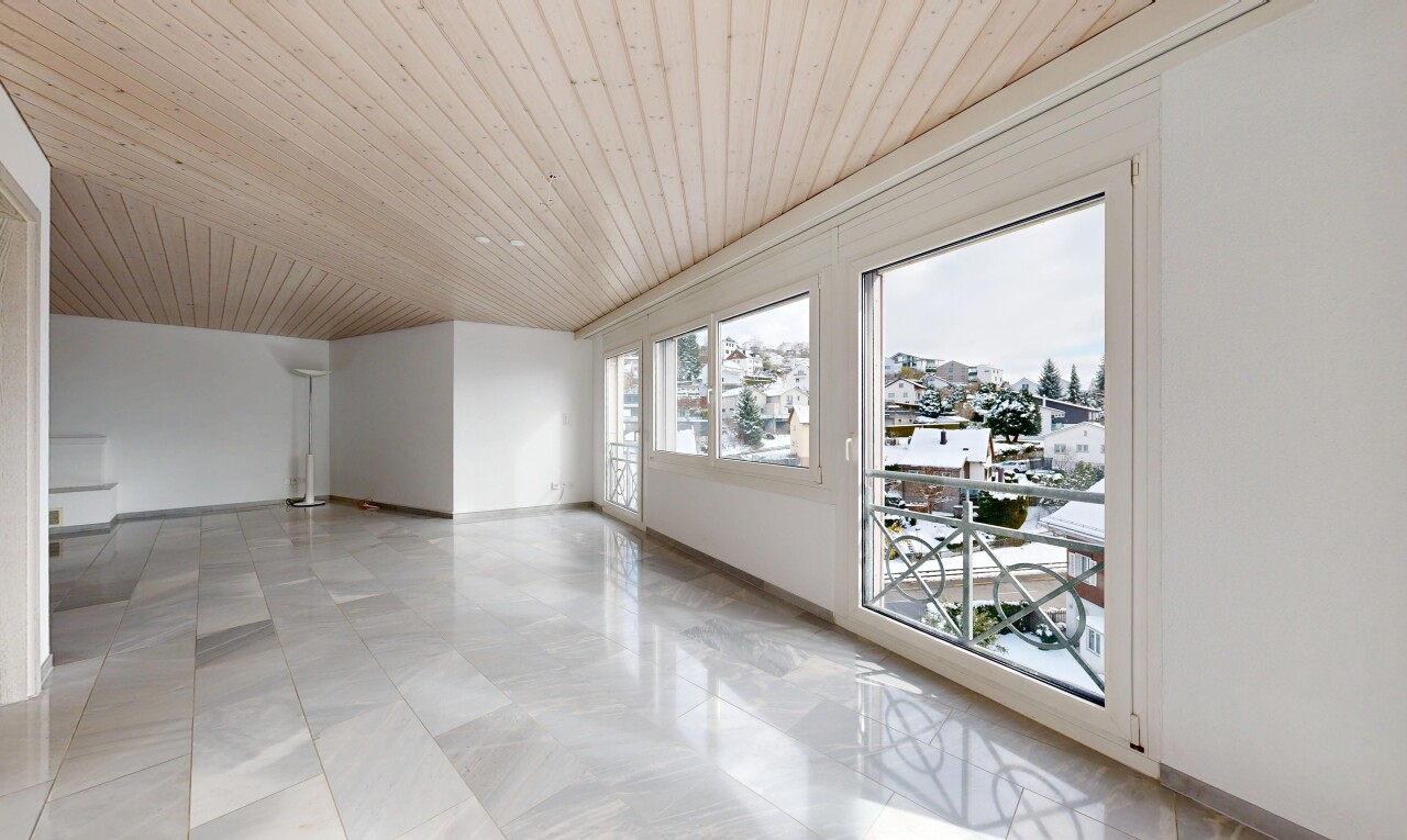 empty room featuring wood ceiling and baseboards