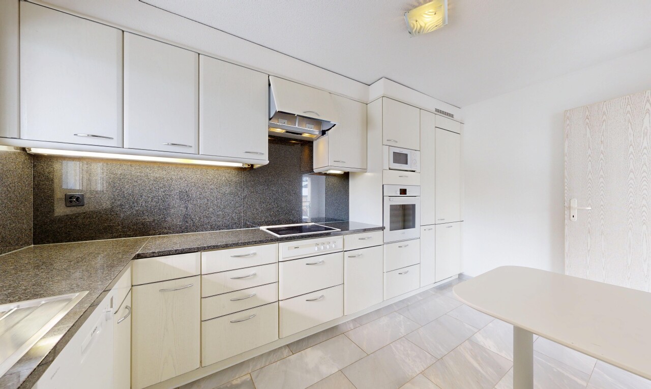 kitchen featuring backsplash, white appliances, dark countertops, and white cabinetry