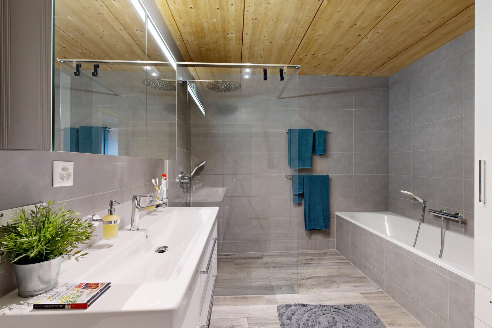 bathroom with wood ceiling, vanity, walk in shower, tile walls, and a garden tub