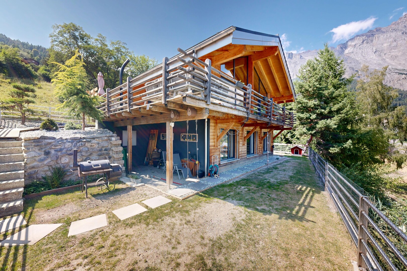outdoor house with a deck with mountain view