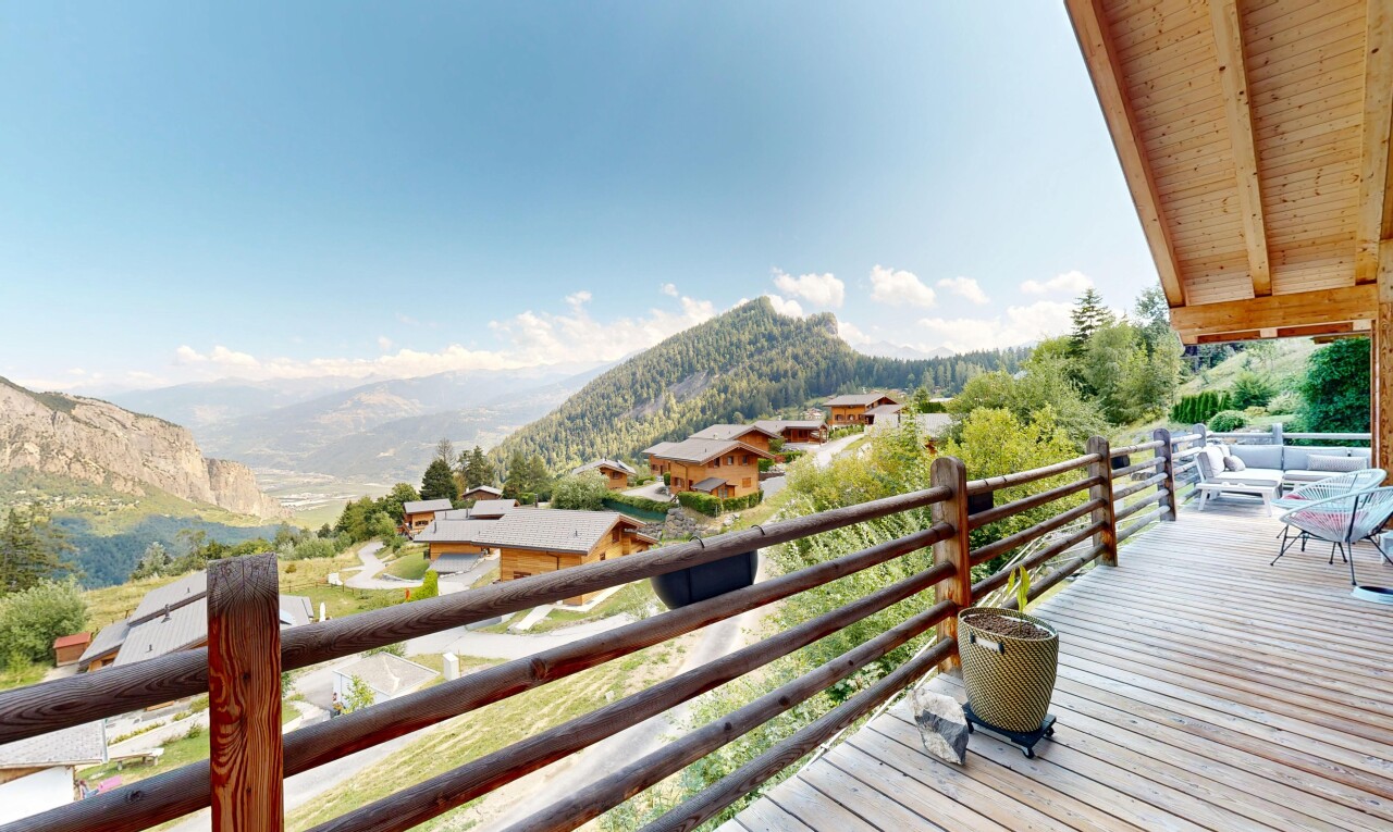 balcony with a deck with mountain view