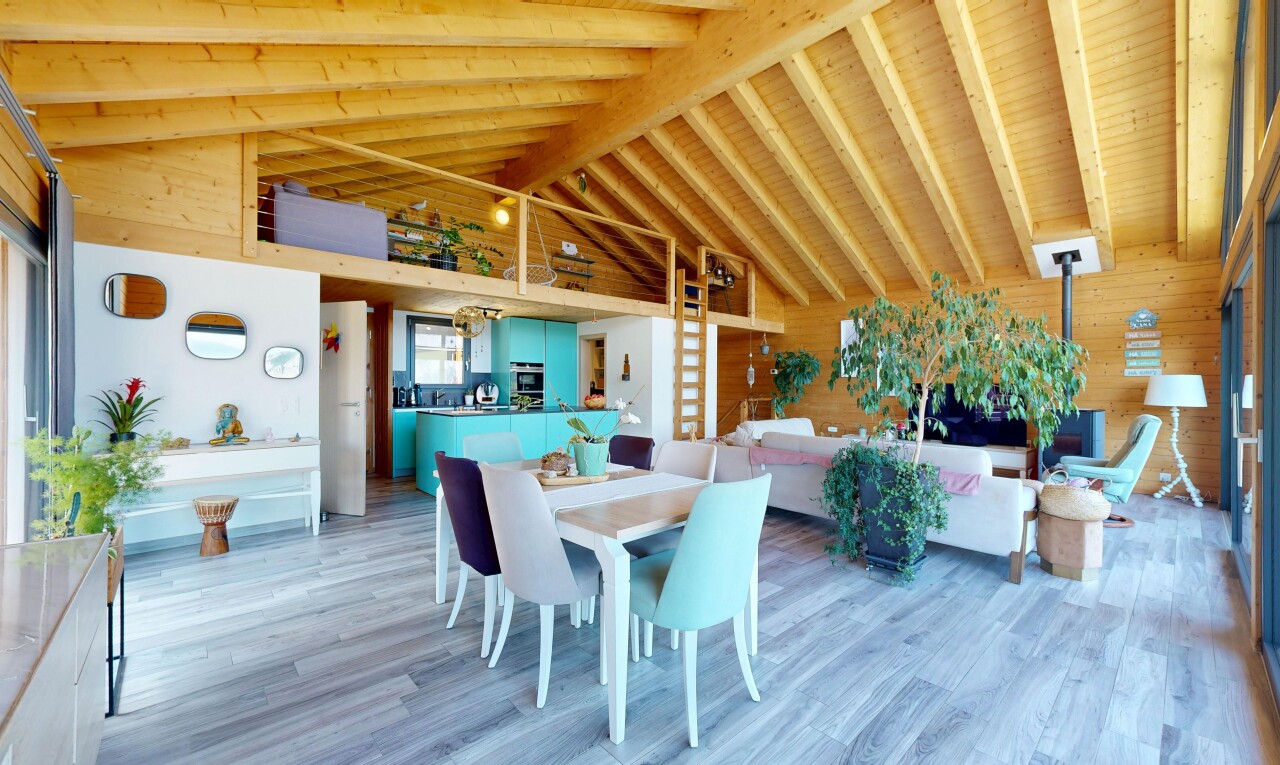 living area featuring light wood-style floors, wood walls, and a high wooden beamed ceiling