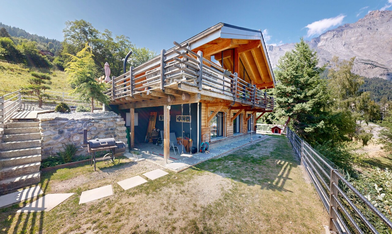outdoor house with a deck with mountain view