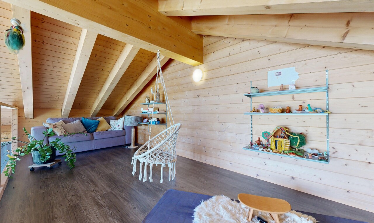 living area featuring lofted ceiling with beams, wood walls, dark wood-style floors, and wooden ceiling