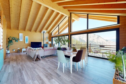 living area with wooden walls and light wood-type flooring