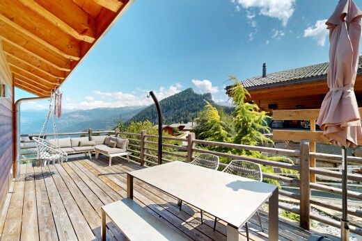 balcony with a deck with mountain view and outdoor lounge area