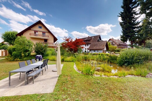 garden with a lawn and a patio area