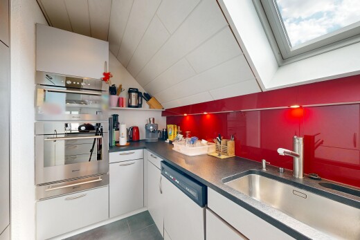 kitchen featuring white cabinets, dark countertops, white dishwasher, and stainless steel double oven