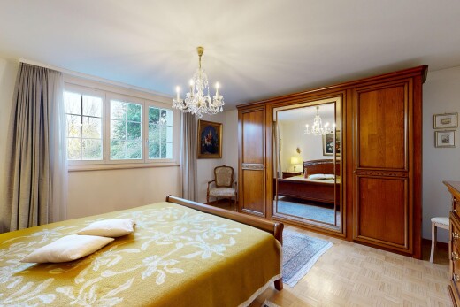 room / bedroom featuring a chandelier