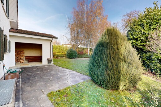 view of home with a lawn, stucco siding, and a patio area