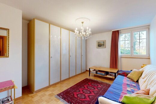 living area featuring a chandelier