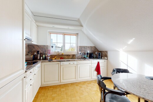 kitchen with tasteful backsplash, paneled dishwasher, lofted ceiling, white cabinets, and light stone countertops