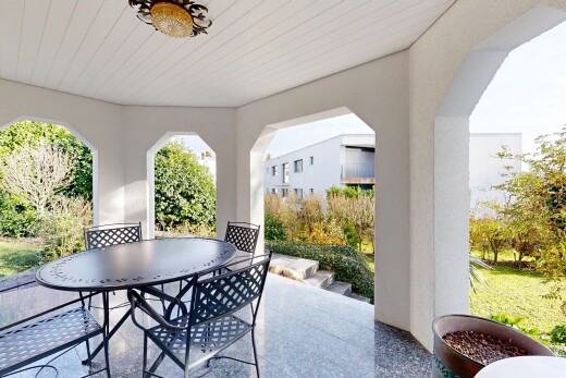 terrace featuring outdoor dining space and a patio area