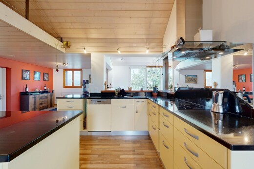 küche mit dark countertops, arbeitsplatten, dunstabzugshaube, inside property, und light floor