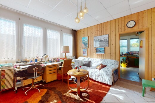 office area with wooden walls, plenty of natural light, and tile patterned flooring