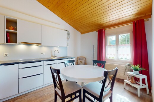 kitchen featuring wood ceiling, lofted ceiling, white cabinetry, light wood-type flooring, and modern cabinets