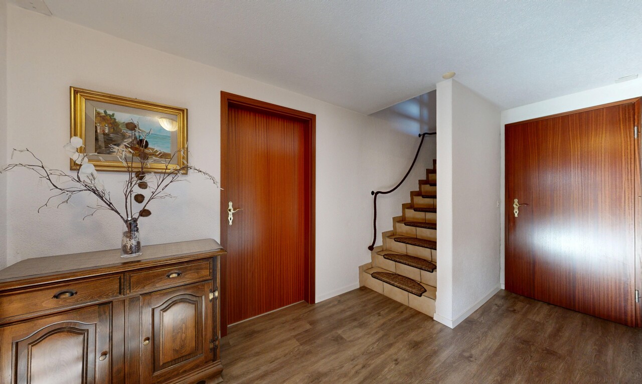 stairs featuring wood finished floors