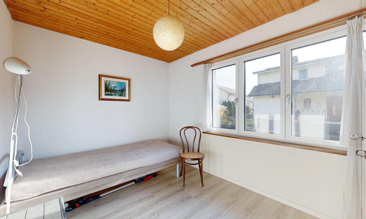 room with wooden ceiling and light wood-style floors