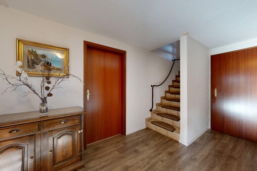 stairs featuring wood finished floors