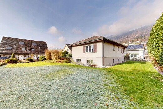 outdoor house featuring a yard and stucco siding