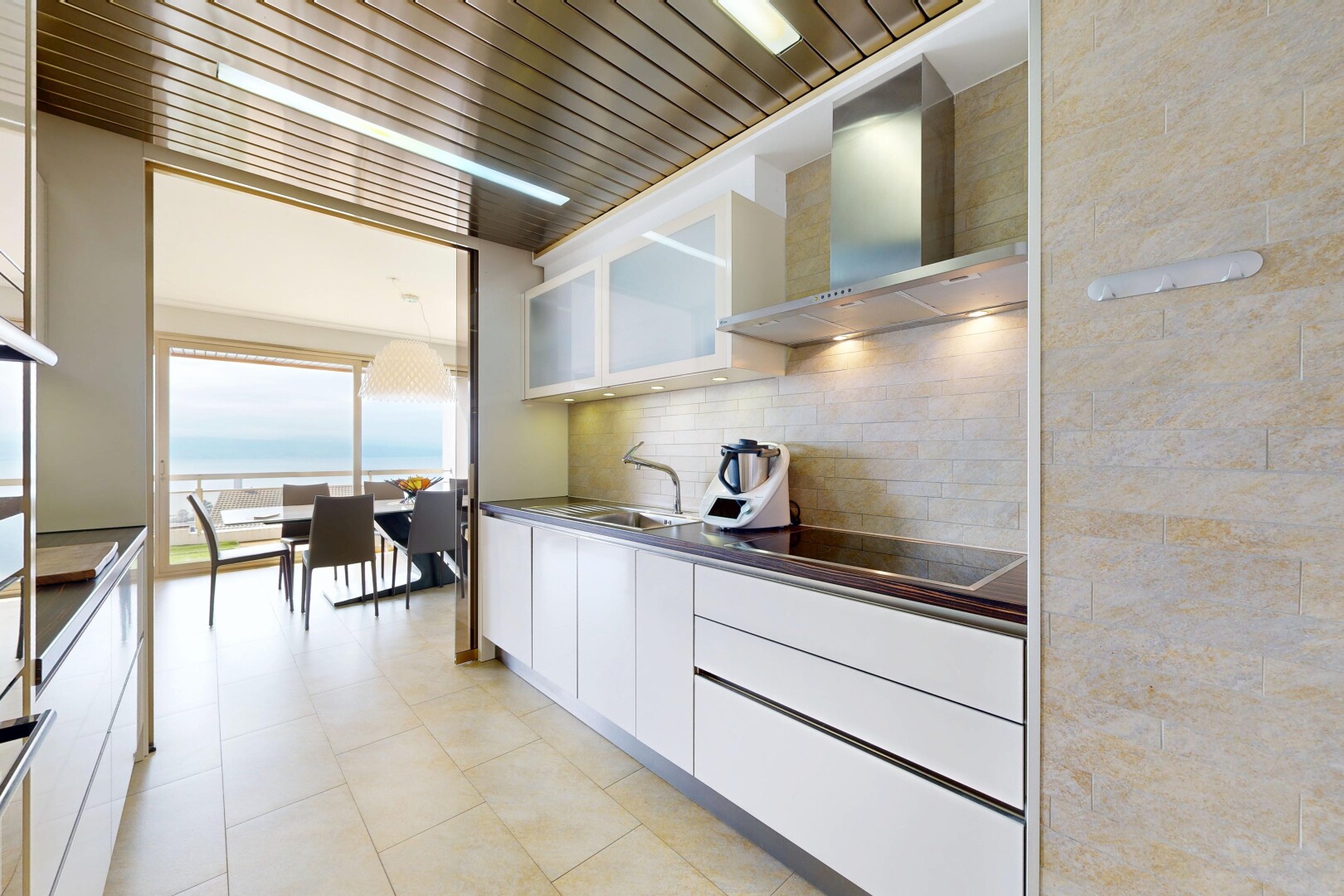kitchen featuring white cabinets, dark countertops, black electric stovetop, tasteful backsplash, and open shelves