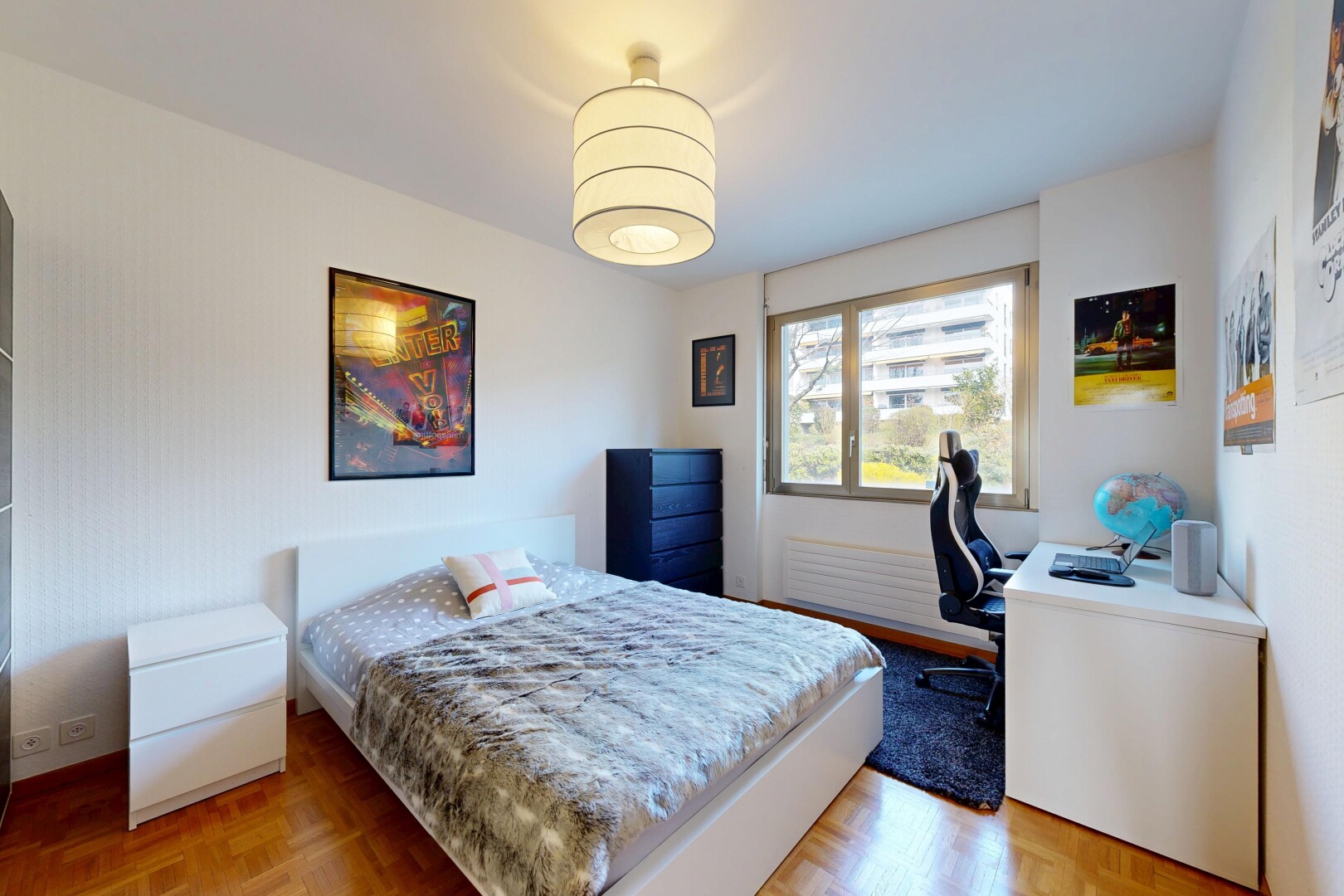 room / bedroom with parquet flooring and a desk