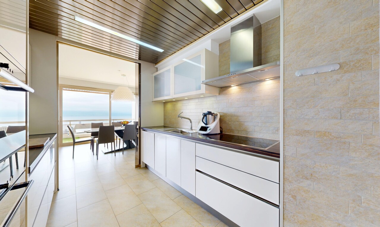 kitchen featuring white cabinets, dark countertops, black electric stovetop, tasteful backsplash, and open shelves