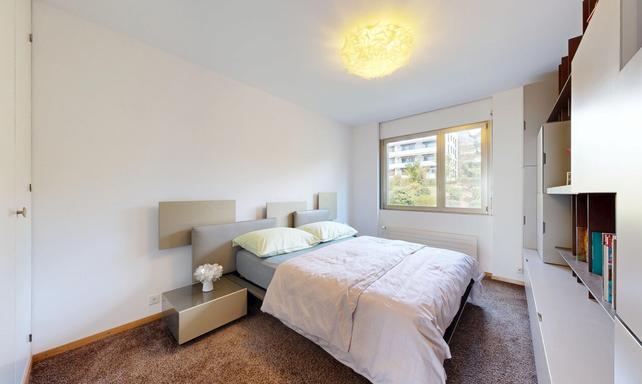 room with dark carpet and baseboards