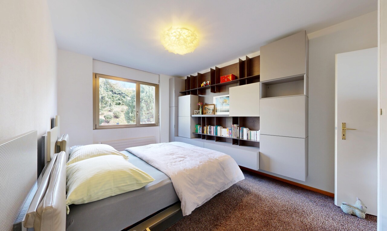 room with dark colored carpet