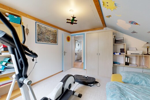 gym with vaulted ceiling and light carpet