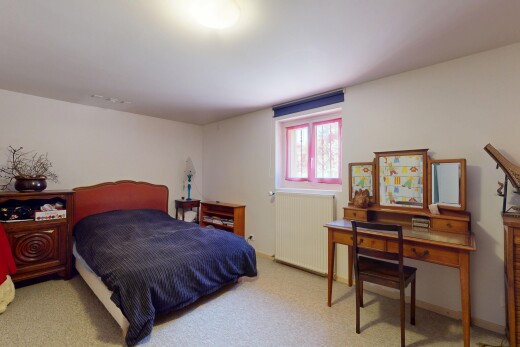 room with radiator and carpet floors