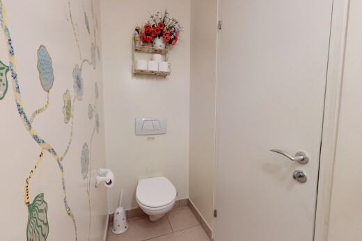 bathroom with tile patterned flooring and toilet