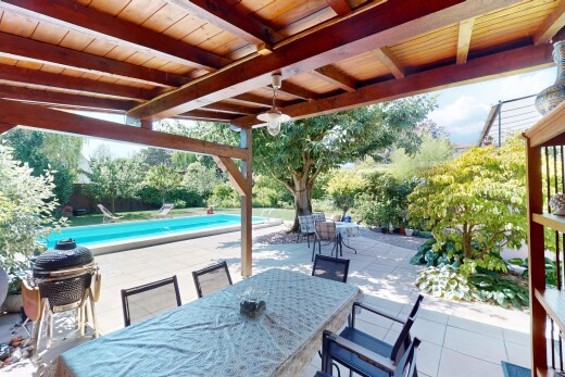 patio / terrace with a patio, an outdoor pool, and outdoor dining space
