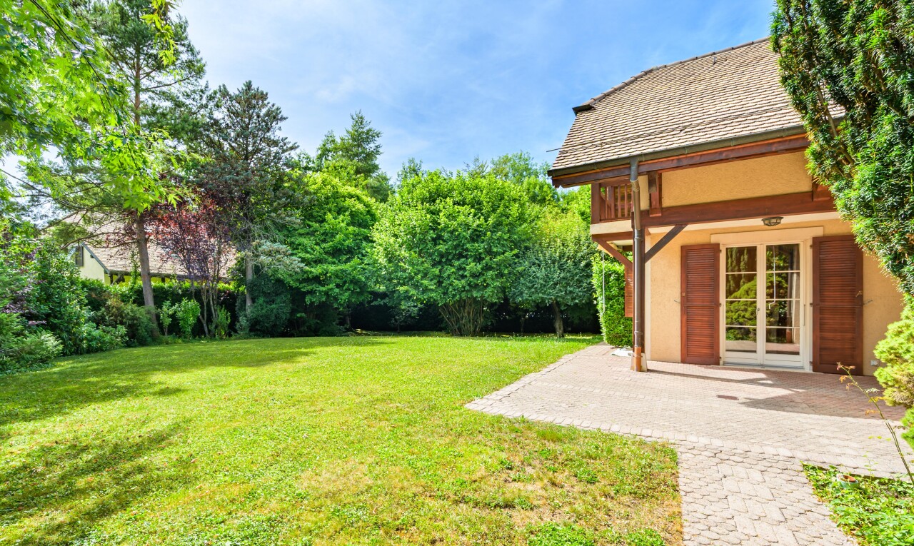 garden with a lawn and a patio area