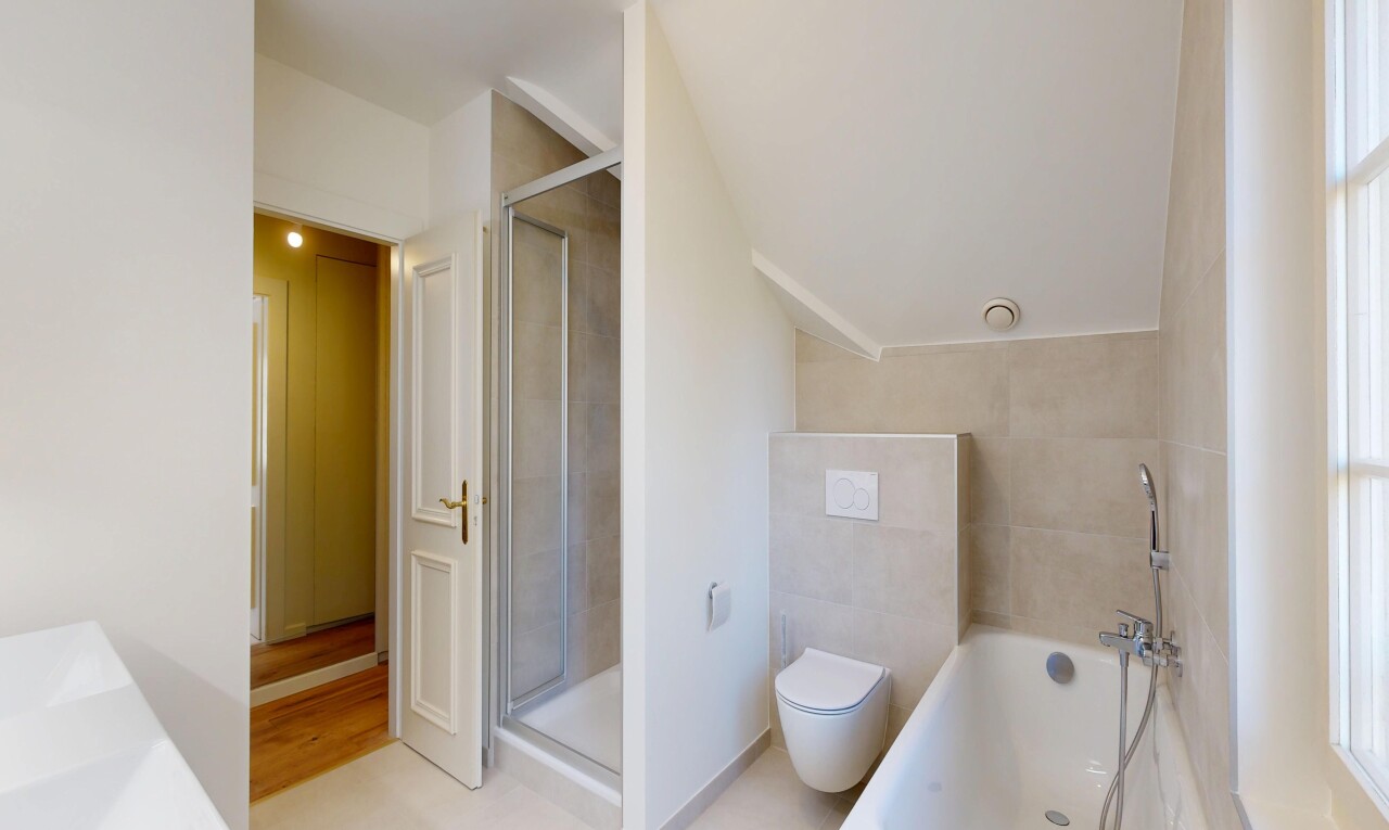 bathroom featuring a garden tub, a stall shower, and vanity