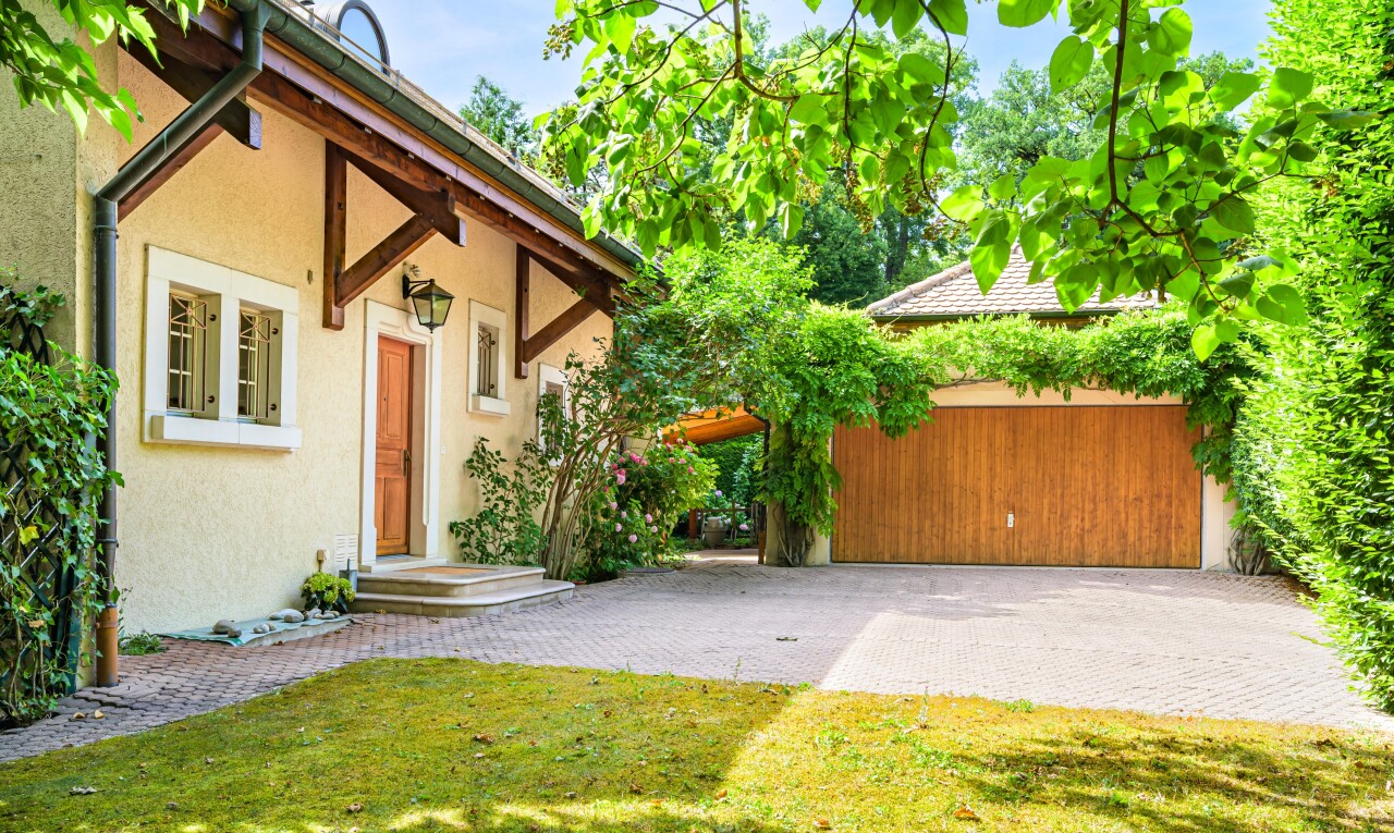 view of home with stucco siding and a garage