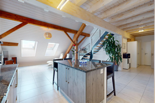 küche mit küchenbar, fliesenboden, stein arbeitsplatten, dachfenster, und balkendecke