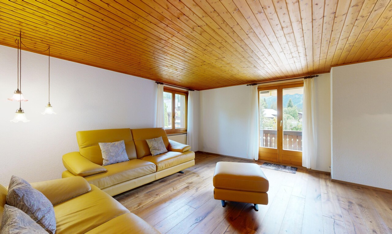 living area with wooden ceiling and hardwood / wood-style floors