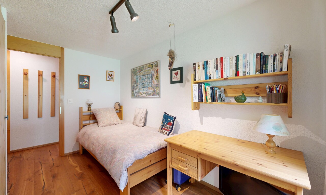 room featuring wood finished floors and ceiling fan