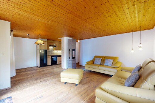 living room with wood ceiling and light wood-style flooring