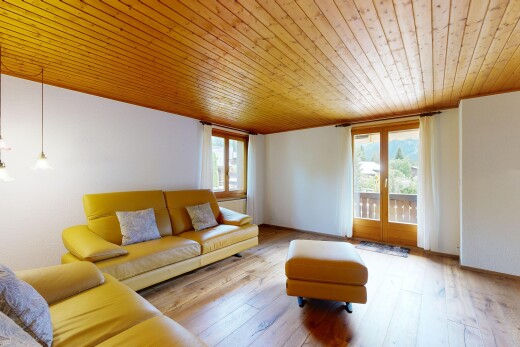 living area with wooden ceiling and hardwood / wood-style floors