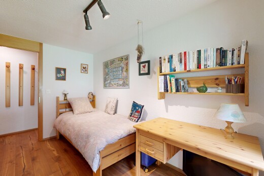 room featuring wood finished floors and ceiling fan
